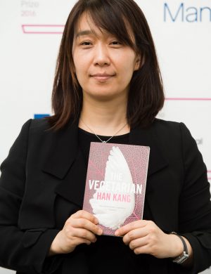 Korean author Han Kang poses for a photograph with her book The Vegetarian at a photocall in London on May 15, 2016, ahead of tomorrow's announcement of the winner of the 2016 Man Booker International Prize. / AFP / Leon NEAL        (Photo credit should read LEON NEAL/AFP/Getty Images)